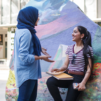 2 female students talking