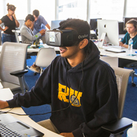 Male student using virtual reality headset